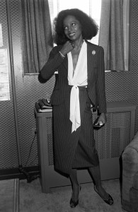 Actress and singer Diana Ross, wearing a pinstripe skirtsuit with a white, tie-front blouse, being interviewed in New York