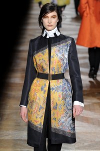 A model on the runway at Dries Van Noten's fall  2012 Ready To Wear show featuring Asian iconography.