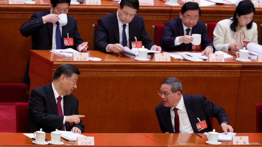 Chinese President Xi Jinping talks with Chinese Premier Li Qiang during the opening of the "Two Sessions" at The Great Hall of People on March 5, 2024 in Beijing, China.