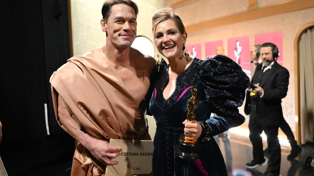 HOLLYWOOD, CALIFORNIA - MARCH 10: In this handout photo provided by A.M.P.A.S., John Cena and Holly Waddington are seen backstage during the 96th Annual Academy Awards at Dolby Theatre on March 10, 2024 in Hollywood, California. (Photo by Al Seib/A.M.P.A.S. via  (Photo by Richard Harbaugh/A.M.P.A.S. via Getty Images)