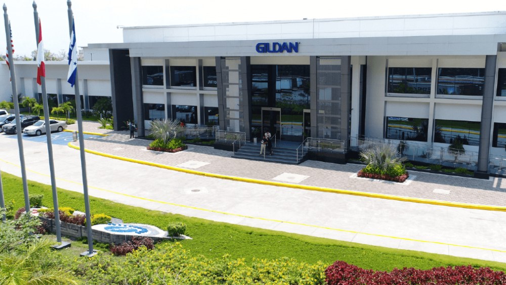 Gildan Activewear has a proxy battle on its hands, and now it is open to a "friendly" takeover after receiving an "expression of interest."