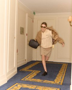 A look at Kristine Froseth getting ready for the Miu Miu Fall 2024 show.