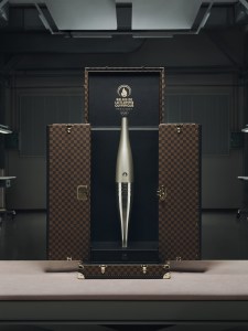 , louis vuitton trunks, medals and torches paris olympics 2024