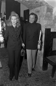 Grace Kelly (L) and Richard Burton carry candles at a party during Elizabeth Taylor's weekend-long 40th birthday celebration in Budapest, Hungary, on Feb. 26-27, 1972.