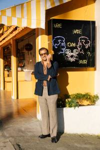 Arman Naféei outside his newsstand art exhibit in Los Angeles, California.