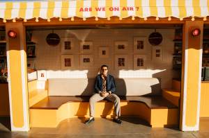 Arman Naféei outside his newsstand art exhibit in Los Angeles, California.