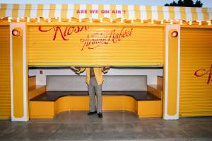 Arman Naféei outside his newsstand art exhibit in Los Angeles, California.