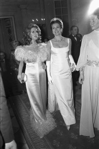 Outtake; Princess Grace of Monaco and Marie-Helene de Rothschild attend the fashion show to benefit the restoration of the Chateau of Versailles, five American designers matching talents with five French couturiers at the Versailles Palace on November 28, 1973 in Versailles, France...Article title: "One night and pouf! It's gone!"