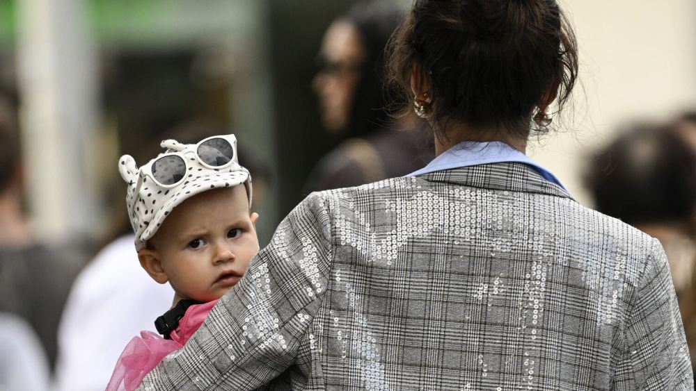 Baby with hat and glasses.