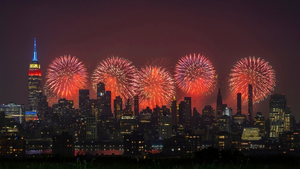 Macy's 4th of July fireworks light up the sky next to the Empire State Building in New York City on July 4, 2023, as seen from Union City, New Jersey.