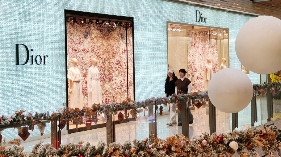 Shoppers walking past a Dior store in Shanghai, China.