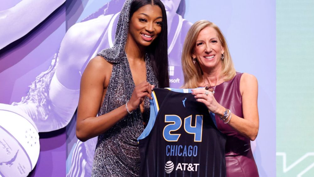 NEW YORK, NEW YORK - APRIL 15: Angel Reese poses with WNBA Commissioner Cathy Engelbert after being selected seventh overall pick by the Chicago Sky during the 2024 WNBA Draft at Brooklyn Academy of Music on April 15, 2024 in New York City. (Photo by Sarah Stier/Getty Images)