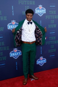 Lamar Jackson of Louisville poses on the red carpet prior to the start of the 2018 NFL Draft at AT&T Stadium on April 26, 2018 in Arlington, Texas.
