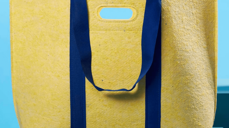An Ikea handbag made from a recycled uniform.