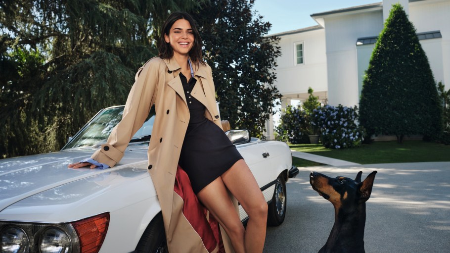Kendall Jenner in Tommy Hilfiger trench coat leaning on car