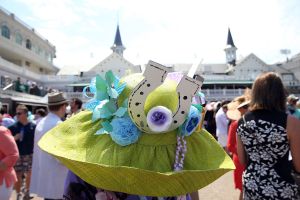 LOUISVILLE, KY - MAY 02:  A woman wearing a festive hat looks on prior to the 141st running of the Kentucky Derby at Churchill Downs on May 2, 2015 in Louisville, Kentucky.  (Photo by Andy Lyons/Getty Images)