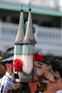 LOUISVILLE, KY - MAY 02:  A woman wearing a festive hat looks on prior to the 141st running of the Kentucky Derby at Churchill Downs on May 2, 2015 in Louisville, Kentucky.  (Photo by Elsa/Getty Images)