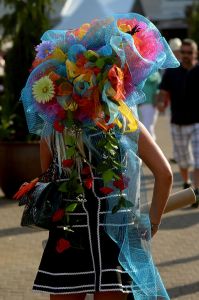 LOUISVILLE, KY - MAY 02:  A woman wearing a festive hat looks on prior to the 141st running of the Kentucky Derby at Churchill Downs on May 2, 2015 in Louisville, Kentucky.  (Photo by Dylan Buell/Getty Images)