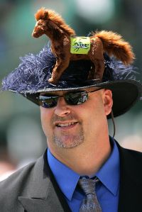 LOUISVILLE, KY - MAY 05:  A fan with a derby hat watches the 6th race, the Third Running of the Alysheba, on Kentucky Oaks day on May 5, 2006 at Churchill Downs in Louisville, Kentucky.  (Photo by Jamie Squire/Getty Images)