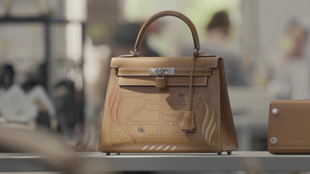 A hand-painted Hermès Kelly handbag.