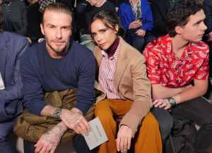 David Beckham and Victoria Beckham in the front row at the Louis Vuitton RTW Fall 2018.