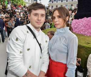 Brooklyn Beckham and Victoria Beckham in the front row at the Dior Homme Spring RTW 2019 show.