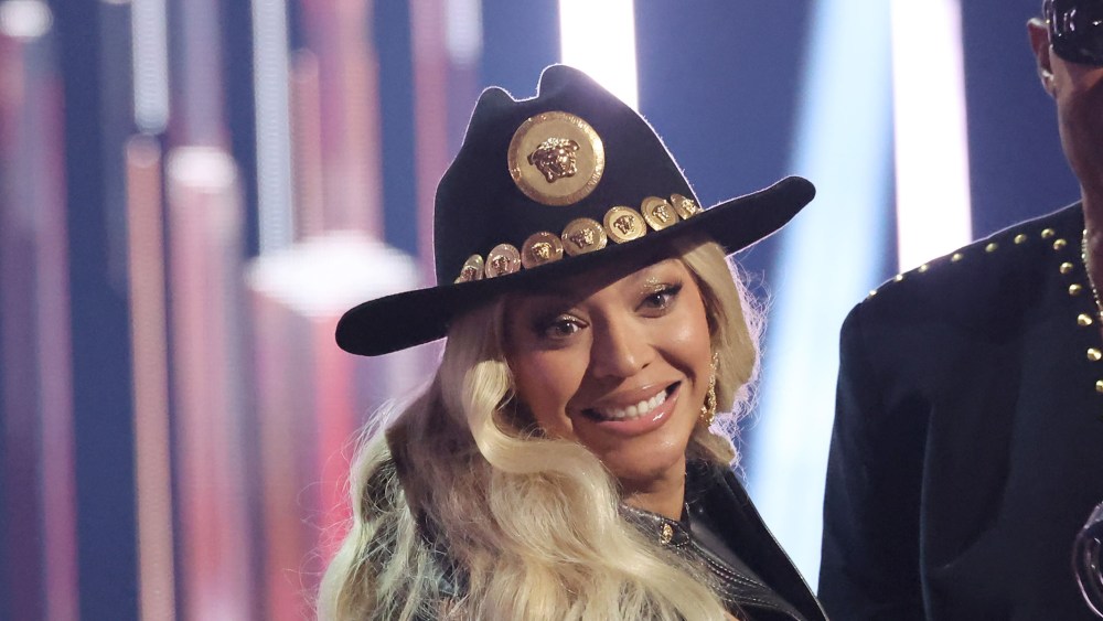 western inspired fashion style trends, versace cowboy hat, HOLLYWOOD, CALIFORNIA - APRIL 01: (L-R) Beyoncé accepts the Innovator Award from Stevie Wonder onstage during the 2024 iHeartRadio Music Awards at Dolby Theatre on April 01, 2024 in Hollywood, California. (Photo by Amy Sussman/Getty Images)