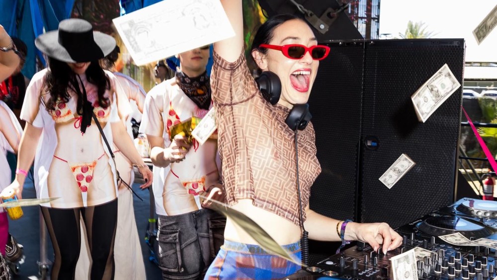 Mia Moretti wears a top by Balmain, Ottolinger trousers, Desigual sneakers and Celine sunglasses on April 14, 2024 at Coachella Music and Arts Festival