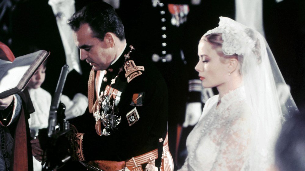 A photo taken on April 19, 1956 shows US actress Grace Kelly and Prince Rainier of Monaco during their wedding ceremony in Monaco.  AFP PHOTO (Photo credit should read /AFP via Getty Images), actress grace kelly wedding dress