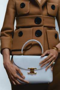 Celine by Hedi Slimane medium Nino bag in supple calfskin; Marc Jacobs virgin wool, polyester, polyamide and polyurethane shrunken jacket and skirt; Retrouvaí Lollipop ring in 14-karat yellow gold with green tourmaline and blue onyx; Burberry bangles