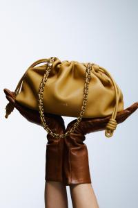 Loewe napa lambskin Flamenco handbag; Carolina Amato gloves.