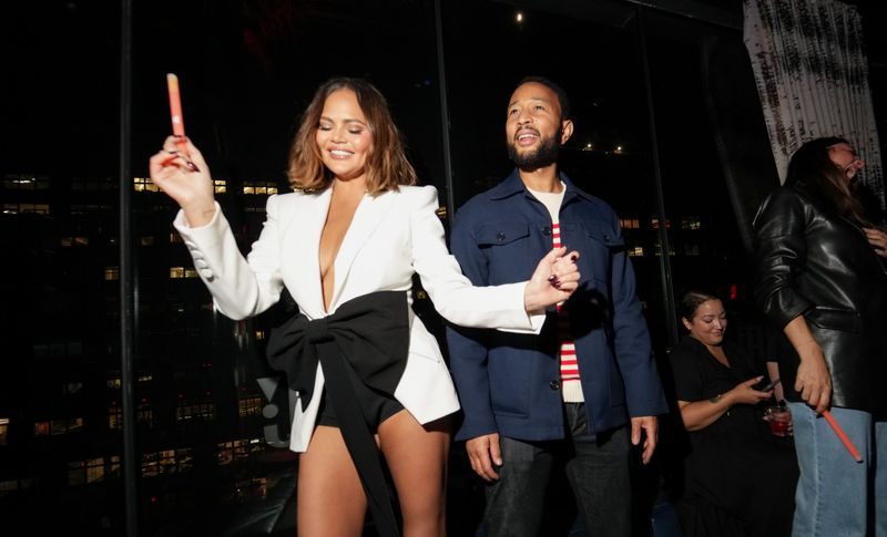 Chrissy Teigen and John Legend at JBL Fest on May 17 in New York, red carpet, Sans Feff, bow blazer