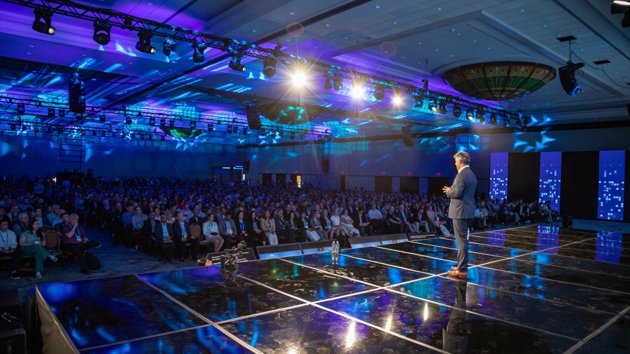 Duncan Angove, CEO of Blue Yonder, speaks on stage at the company's conference in Dallas.