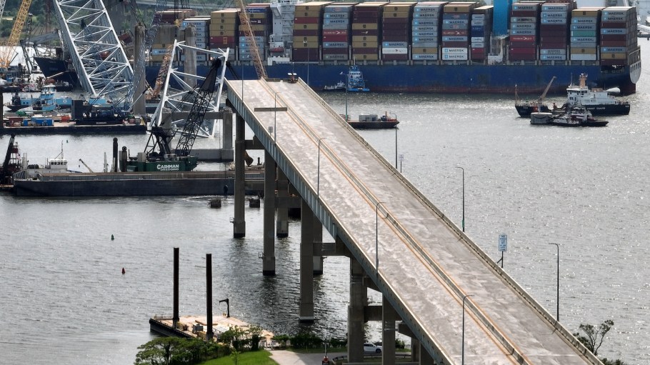 The remaining northern span of the Francis Scott Key Bridge points to the Dali six weeks after the cargo ship collided with and destroyed the bridge .