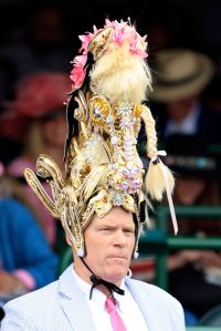 LOUISVILLE, KENTUCKY - MAY 03: A fan wearing a festive hat looks on ahead of the 150th running of the Kentucky Derby on Saturday at Churchill Downs on May 03, 2024 in Louisville, Kentucky.  (Photo by Justin Casterline/Getty Images)