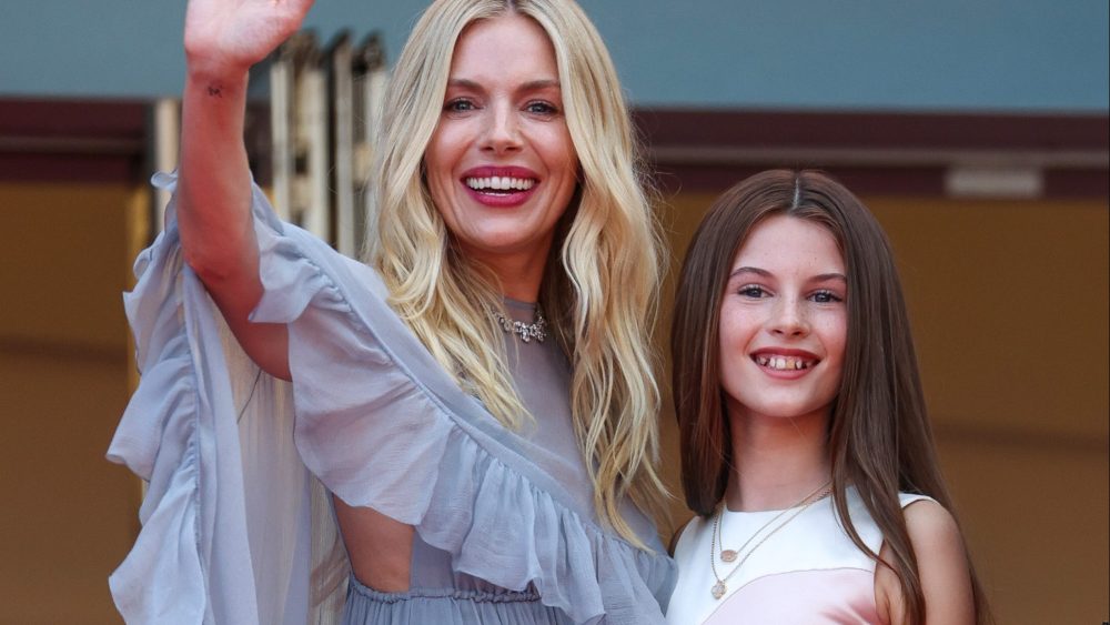 Sienna Miller and daughter Marlowe Sturridge attend the "Horizon: An American Saga" premiere at Cannes Film Festival on May 19, Chloé, Chopard, red carpet