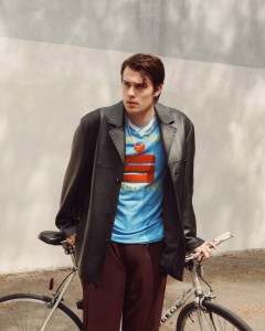 Nicholas Galitzine wears Fendi leather jacket and pants; vintage Adidas “Disco-Pub” recreational football league jersey sourced by Levi’s Knits ‘N’ Knackeries; David Yurman box chain necklace in18-karat yellow gold.