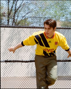 Nicholas Galitzine wears Vintage Adidas Arsenal soccer jersey sourced by Levi’s Knits ‘N’ Knackeries; Maharishi cotton and recycled polyester pants; Jonas Studio sterling silver bracelet.