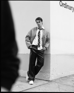 Nicholas Galitzine wears Y/Project polyester bomber jacket; Brooks Brothers cotton shirt; United Colors of Benetton leather pants; Reebok sneakers.
