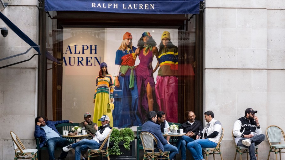 Customers gather together at the outside cafe tables at the Ralph Lauren shop on Bond Street on 22nd May 2023 in London, United Kingdom.
