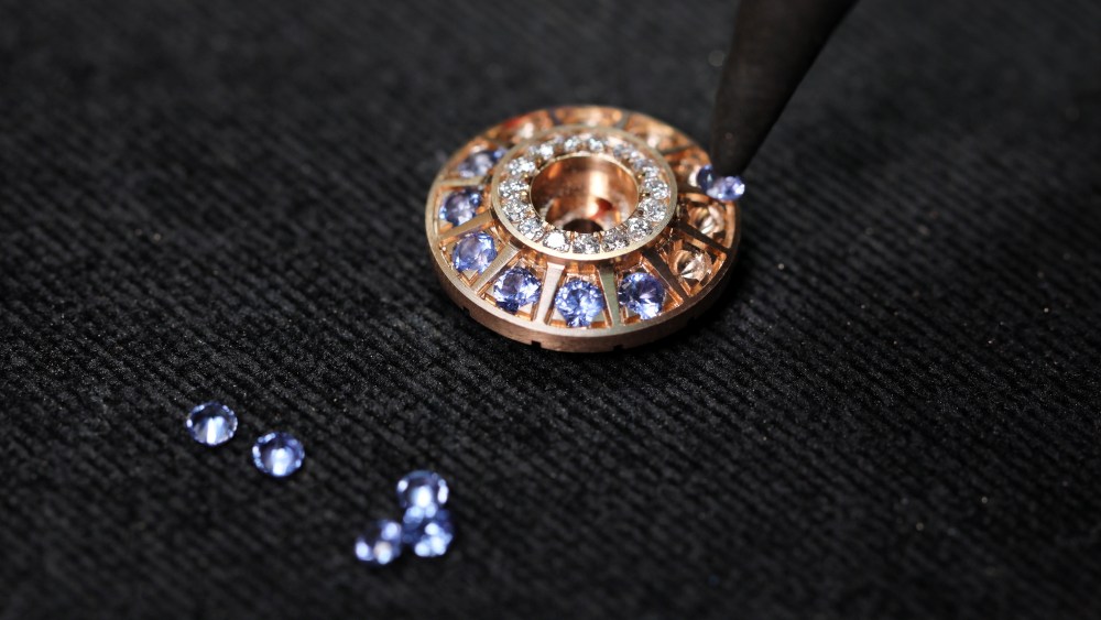 Gems being set into a medallion of Aneka's Charkha collection.