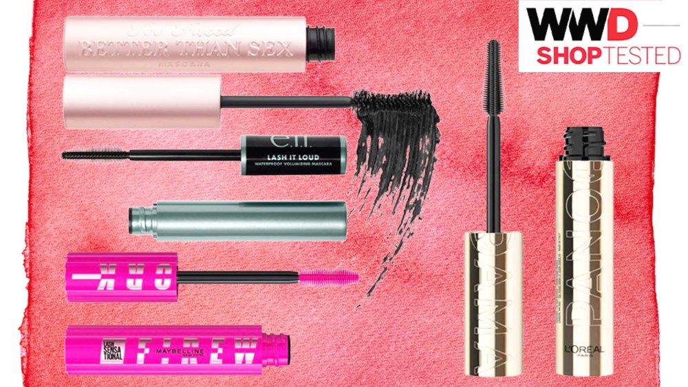 four mascara tubes over a red watercolor background