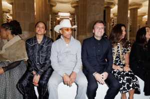 Helen Lasichanh, Pharrell Williams, Pietro Beccari and Elisabetta Beccari front row at the Louis Vuitton Cruise 2025 show.