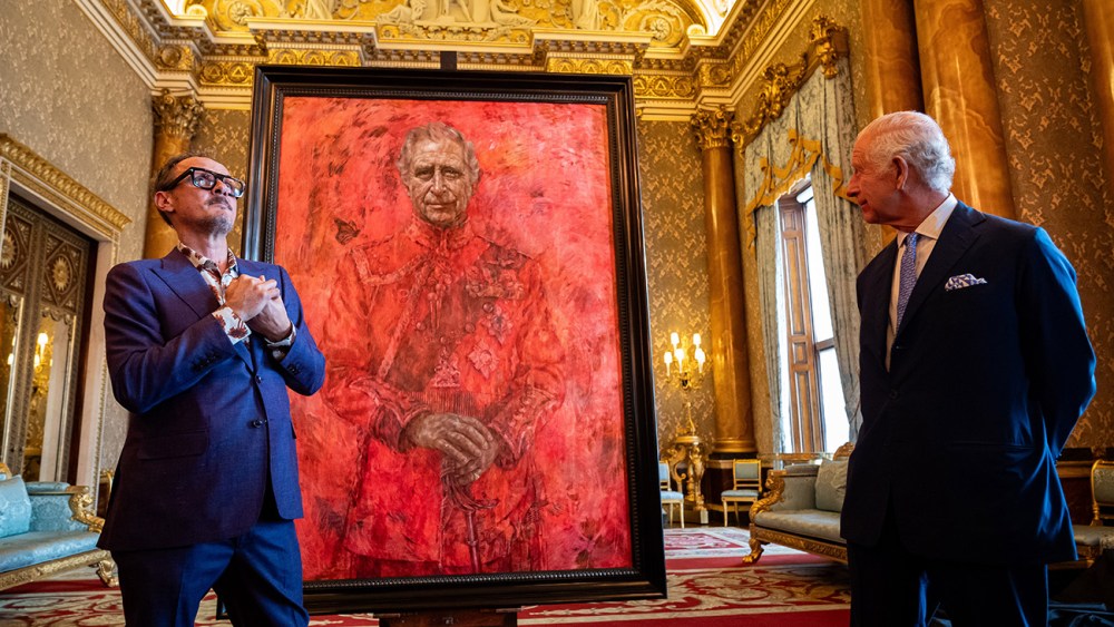 LONDON, ENGLAND - MAY 14: Artist Jonathan Yeo and King Charles III stand in front of the portrait of the King Charles III by artist Jonathan Yeo as it is unveiled in the blue drawing room at Buckingham Palace on May 14, 2024 in London, England. The portrait was commissioned in 2020 to celebrate the then Prince of Wales's 50 years as a member of The Drapers' Company in 2022. The artwork depicts the King wearing the uniform of the Welsh Guards, of which he was made Regimental Colonel in 1975. The canvas size - approximately 8.5 by 6.5 feet when framed - was carefully considered to fit within the architecture of Drapers' Hall and the context of the paintings it will eventually hang alongside. Jonathan Yeo had four sittings with the King, beginning when he was Prince of Wales in June 2021 at Highgrove, and later at Clarence House. The last sitting took place in November 2023 at Clarence House. Yeo also worked from drawings and photographs he took, allowing him to work on the portrait in his London studio between sittings. (Photo by Aaron Chown-WPA Pool/Getty Images)