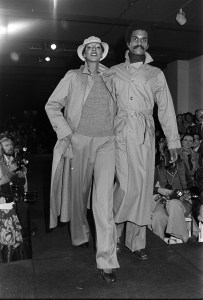 Models Ramona Saunders and Renauld White in trench coats from Calvin Kleins' fall 1975 Ready to Wear collection during a fashion show at Klein's design headquarters at 205 West 39th Street in Manhattan on May 6, 1975.