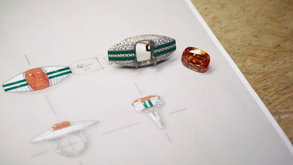 The center stone of Chanel's Graphic Line high jewelry ring is a 30.67-carat mandarin garnet, seen here next to the unfinished ring and its sketches.