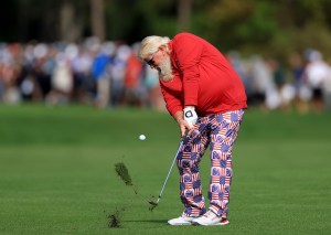 John Daly of The United States plays his second shot on the first hole during the first round of the 2022 PNC Championship at The Ritz-Carlton Golf Club on December 17, 2022 in Orlando, Florida.