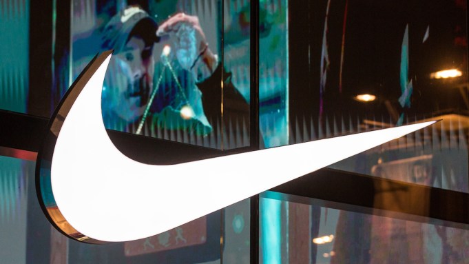 ANTWERP, BELGIUM - 2024/02/15: Illuminated trademark of the American athletic footwear and apparel corporation Nike, Inc. seen on the Nike Store window in Antwerp, Belgium. (Photo by Karol Serewis/SOPA Images/LightRocket via Getty Images)