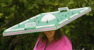 A lady wears a mini football pitch on her head during Ladies Day on the third day of Royal Ascot at the Ascot Racecourse on June 17, 2004 in Berkshire, England. The event has been one of the highlights of the racing and social calendar since 1711 with Queen Anne, and the royal patronage continues today with a Royal Procession taking place in front of the grandstands daily.