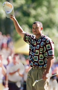 US Ryder Cup team member Tiger Woods waves to the crowd around the 16th green after defeating Andrew Coltart of Scotland in their singles matches 26 September, 1999  at The Country Club in Brookline, Massachusetts, the site of the 33rd Ryder Cup. Woods won the match 3 and 2.